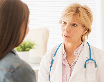 HCP-patient-discussion-in-office HCP and patient discussing health needs in office