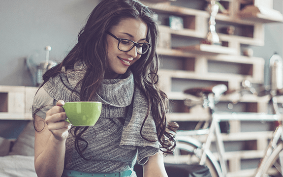 Woman at laptop - Image of a smiling woman working on her laptop. Woman at laptop - Image of a smiling woman working on her laptop.